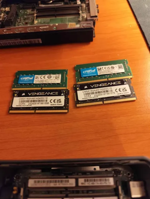 The RAM swap: two Crucial 8 GB sticks and two Corsair Vengeance 16 GB sticks on the desk